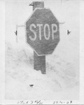 Buried stop sign by The Buffalo Courier-Express Newspaper