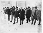 Mayor Makowski and crowd walking through the snow