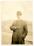 A man in a coat and hat by The Francis Fronczak Collection